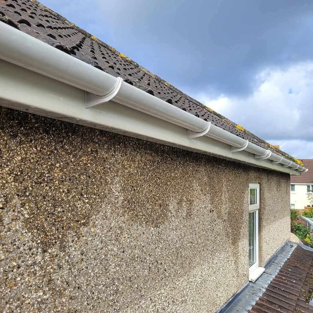 Gutter and downpipe at a residential roofline