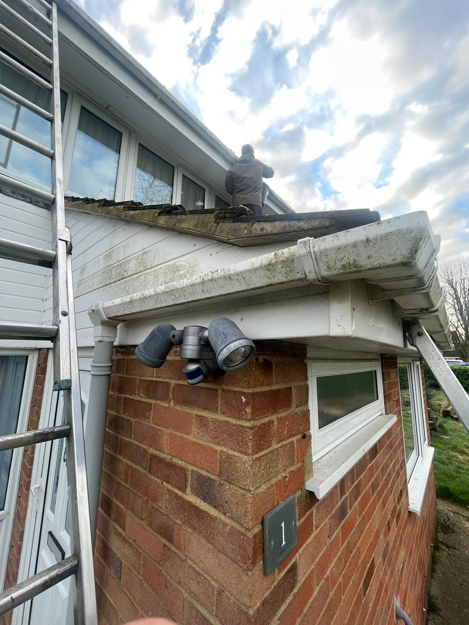 Gutter clearing access at roof edge