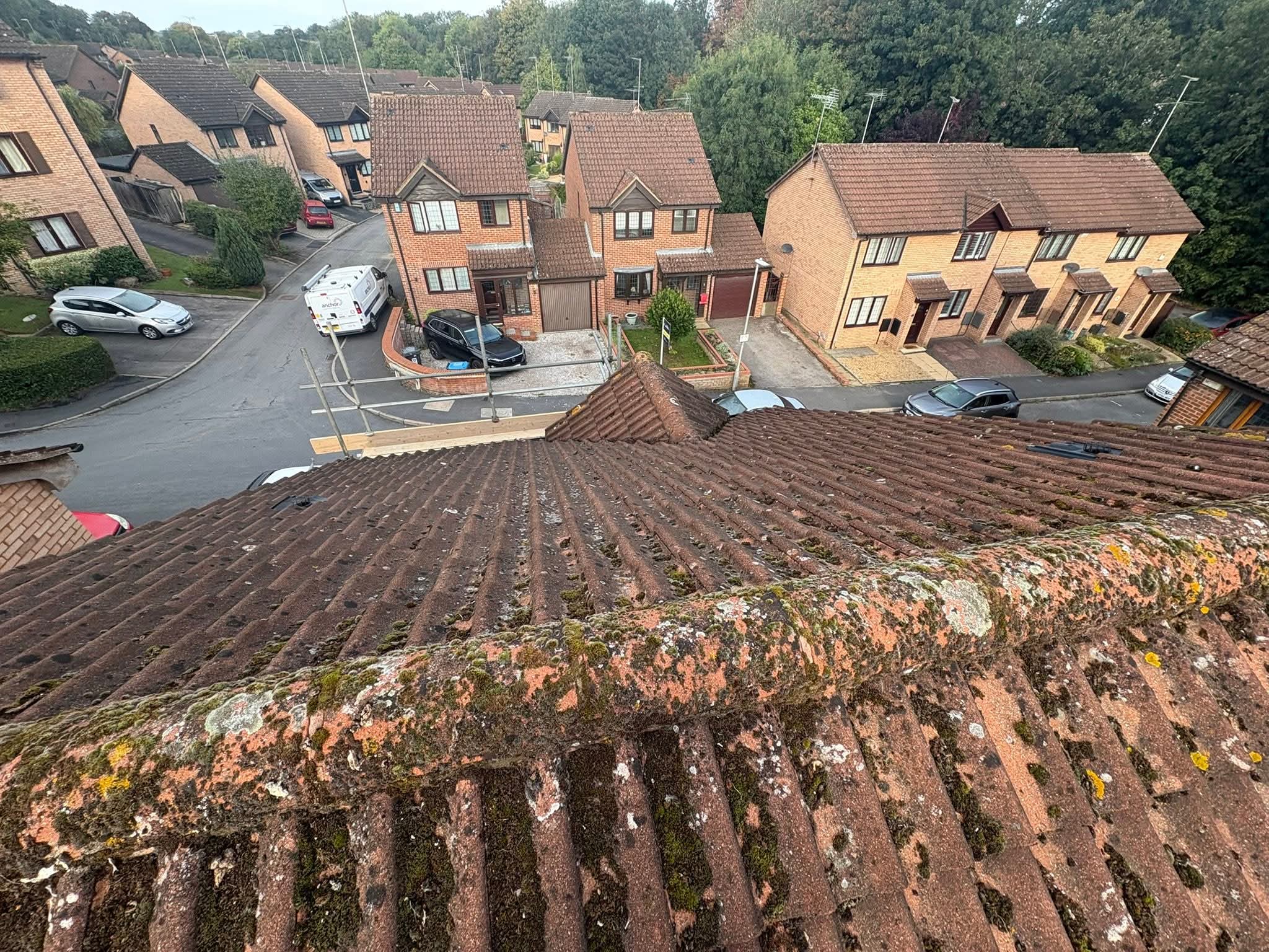 Roof cleaning at eaves and gutter line