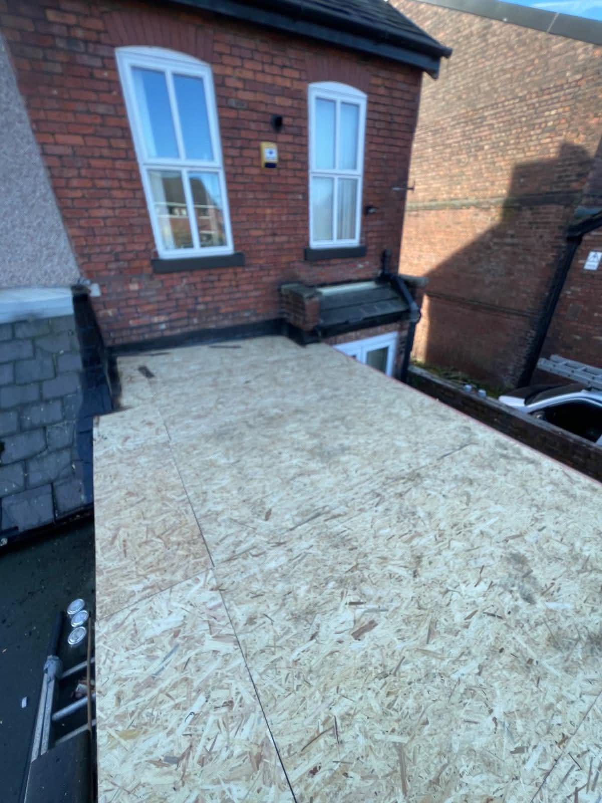 Torch-applied reinforced felt on a flat roof